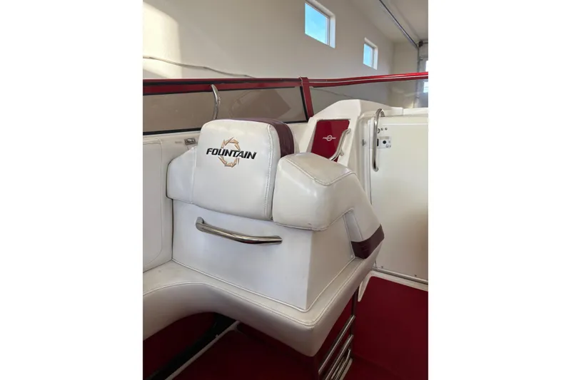 Slide: The Image of Interior of 2006 Fountain 42 Lightning boat with white and red seating. - 33