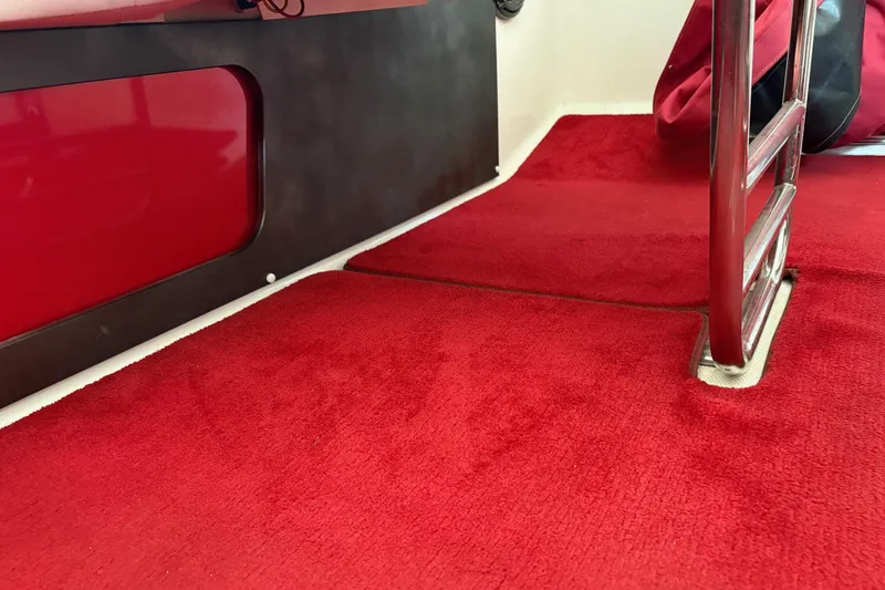 Slide: The Image of Red carpet interior of 2006 Fountain 42 Lightning boat with metal ladder. - 35