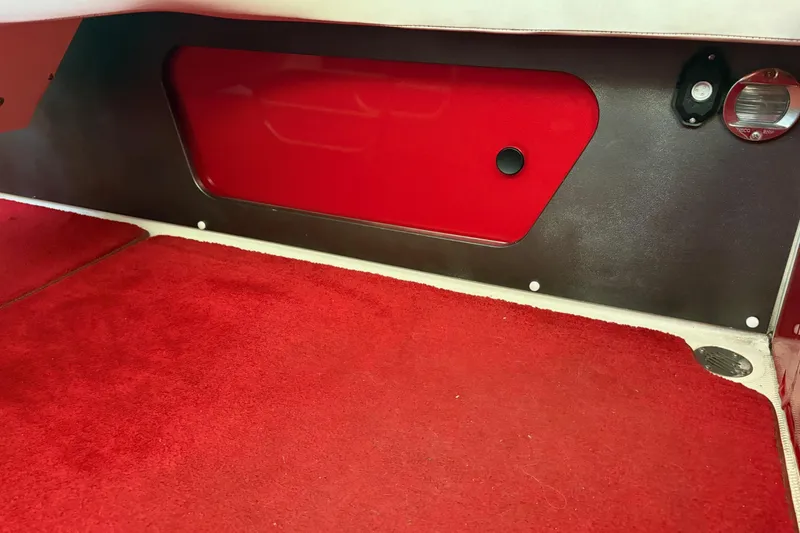 Slide: The Image of Interior of 2006 Fountain 42 Lightning boat with red carpet and paneling. - 36