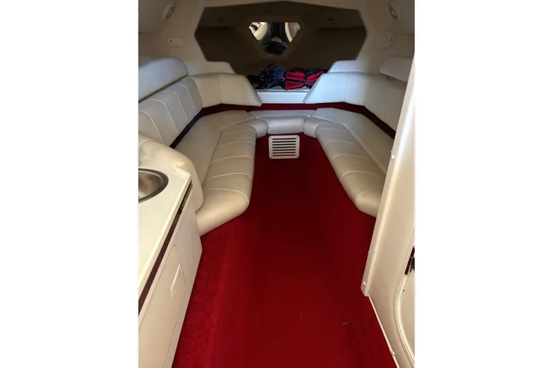 Slide: The Image of Interior of 2006 Fountain 42 Lightning boat with red carpet and white seating. - 42