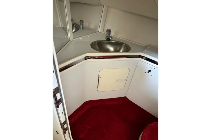 Slide: The Image of Interior of 2006 Fountain 42 Lightning boat with sink and red carpet. - 45