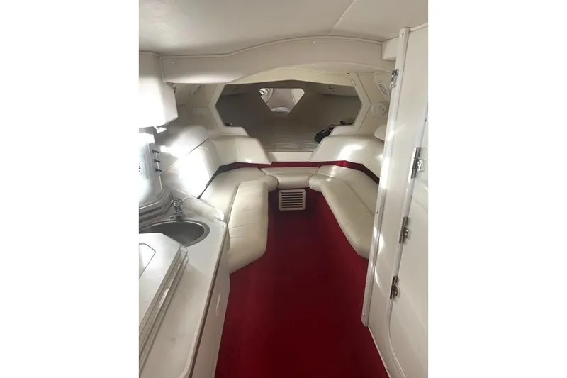 Slide: The Image of Interior of 2006 Fountain 42 Lightning boat with white seating and red carpet. - 47