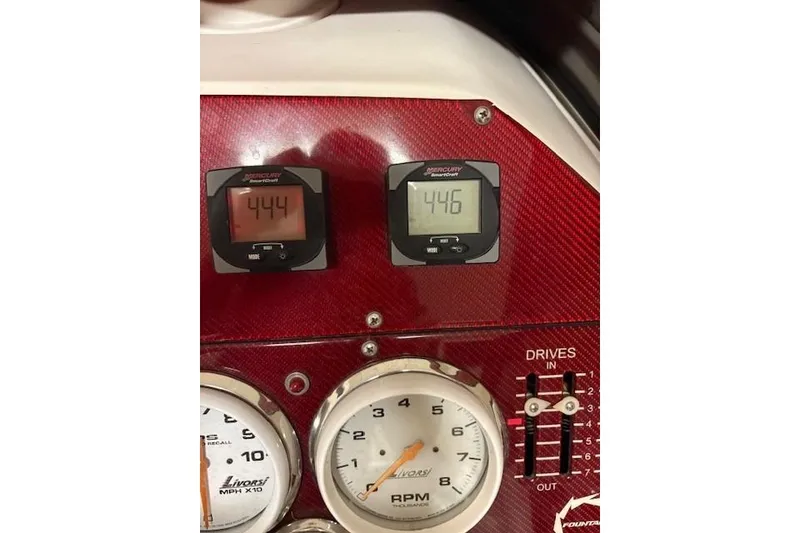 Slide: The Image of Dashboard of a 2006 Fountain 42 Lightning boat with gauges and controls. - 48