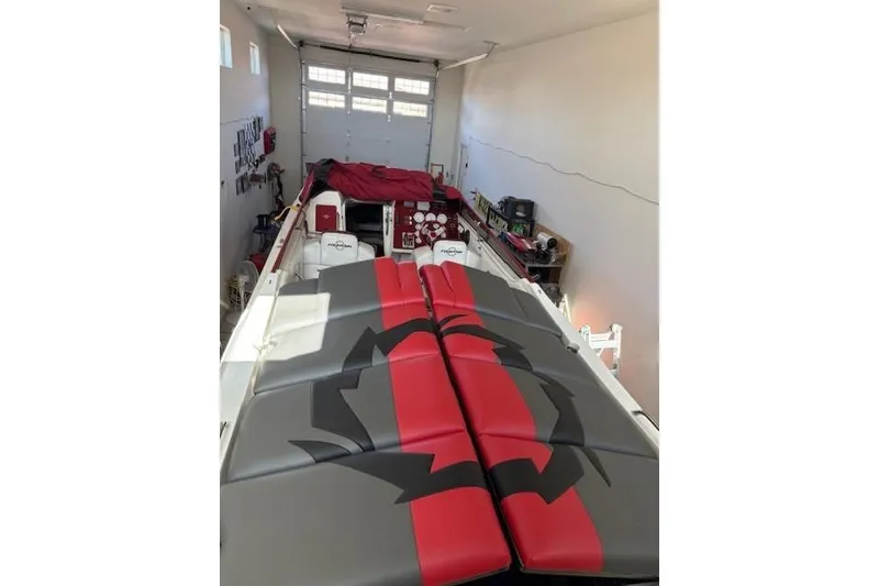 Slide: The Image of 2006 Fountain 42 Lightning boat in garage, red and gray upholstery, overhead view. - 49