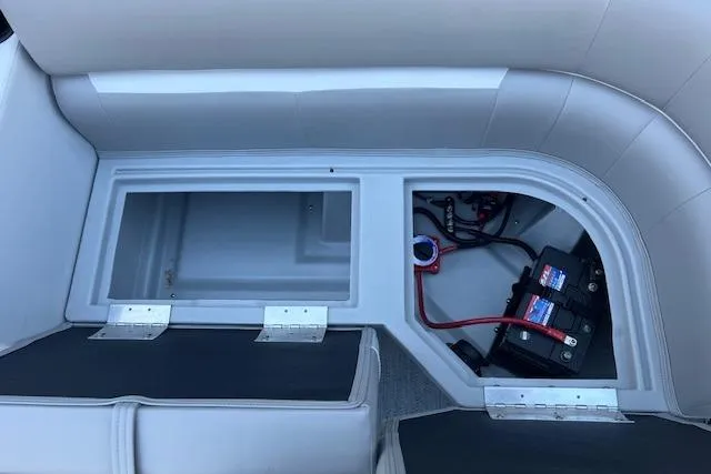 Slide: The Image of Storage and battery compartment of 2026 Godfrey EX 2286 SBX boat. - 10