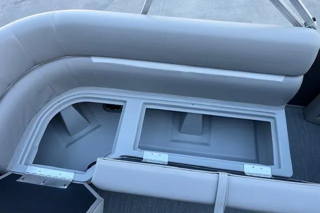 Slide: The Image of 2026 Godfrey EX 2286 SBX boat seating with open storage compartment. - 11