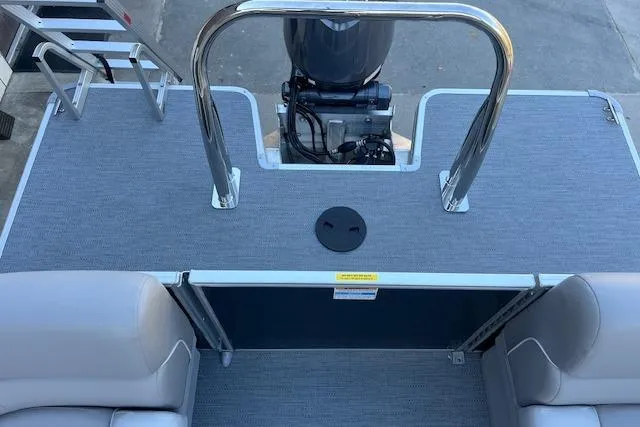 Slide: The Image of 2026 Godfrey EX 2286 SBX boat deck with seating and motor view. - 12