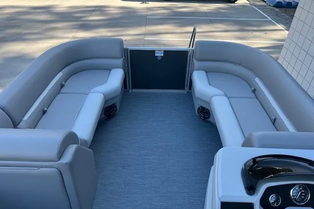 Slide: The Image of 2026 Godfrey EX 2286 SBX pontoon boat interior with gray seating and flooring. - 13