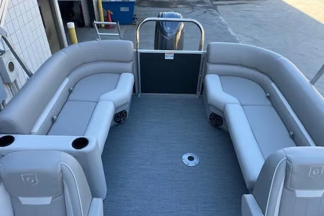 Slide: The Image of 2026 Godfrey EX 2286 SBX pontoon boat interior with gray seating and spacious layout. - 7