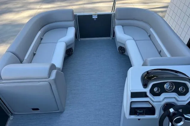 Slide: The Image of Luxurious 2026 Godfrey EX 2286 SBX pontoon boat interior with plush seating and modern dashboard. - 8