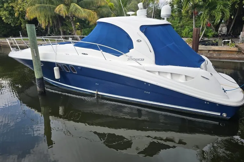 The Image of 2008 Sea Ray 40 Sundancer yacht docked, featuring blue and white design. - 0