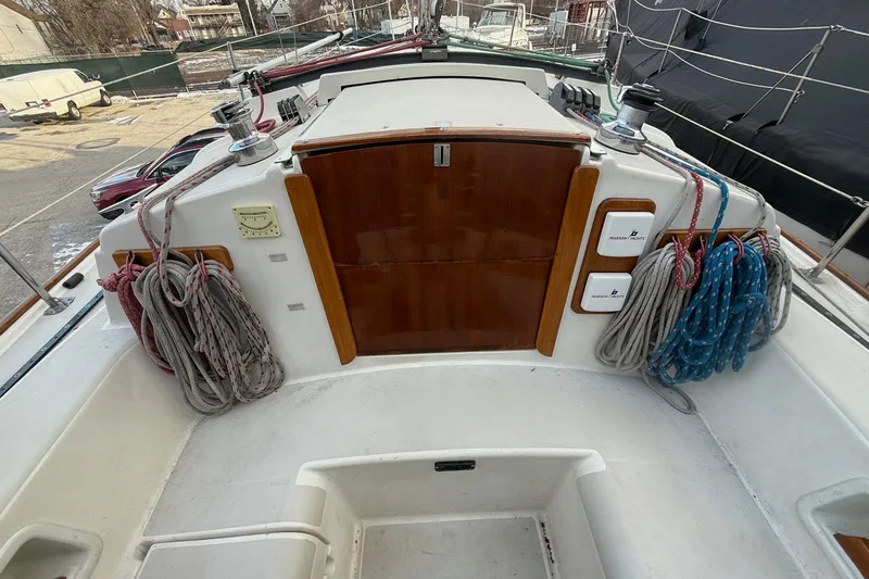 Slide: The Image of Cockpit of 1986 Pearson 303 sailboat with ropes and wooden hatch. - 6