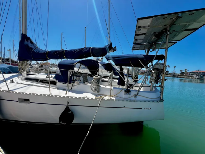 Slide: The Image of 1981 Cheoy Lee Golden Wave sailboat docked in sunny marina. - 1