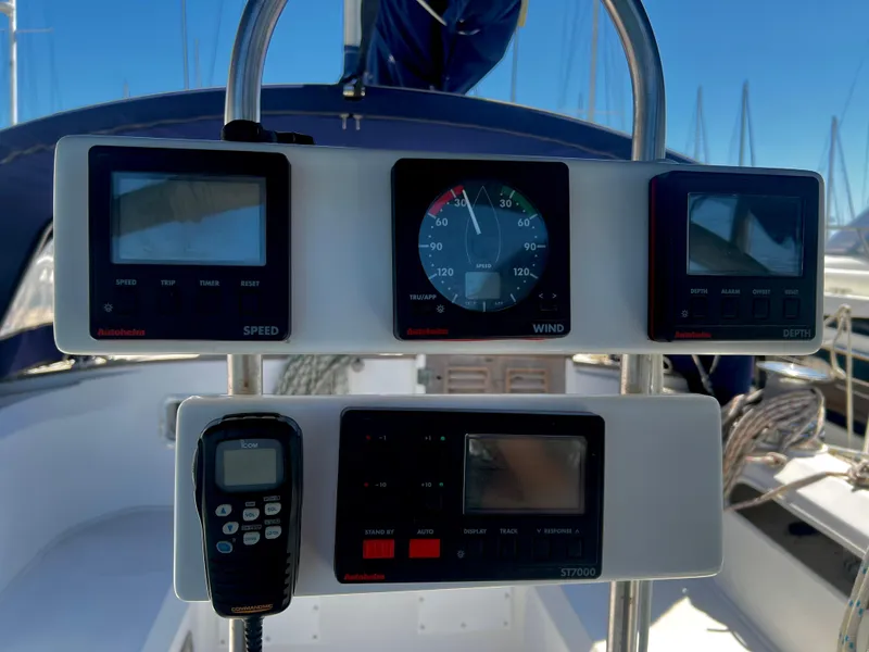 Slide: The Image of Cockpit instruments on 1981 Cheoy Lee Golden Wave yacht, featuring speed, wind, and depth displays. - 15