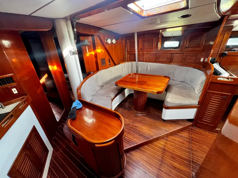 Slide: The Image of 1981 Cheoy Lee Golden Wave yacht interior with wooden finish and cozy seating area. - 21