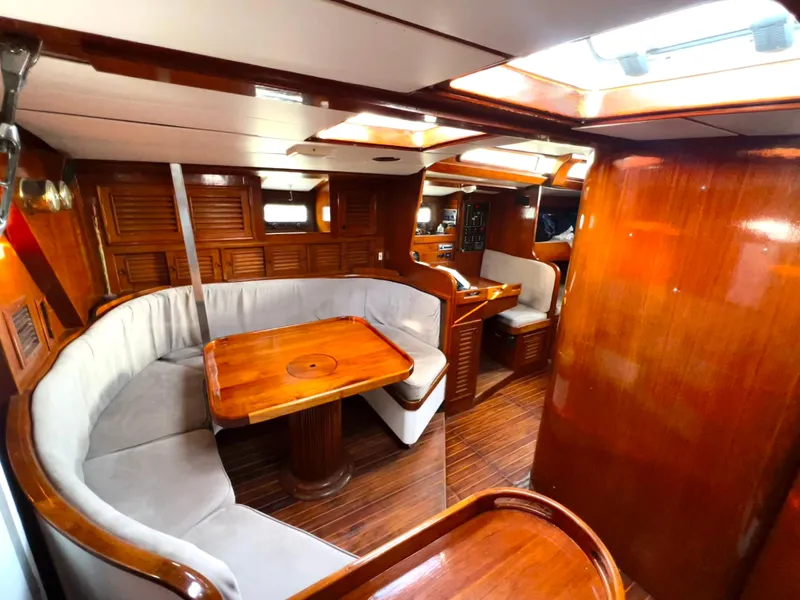 Slide: The Image of 1981 Cheoy Lee Golden Wave yacht interior with wooden finishes and cozy seating area. - 30