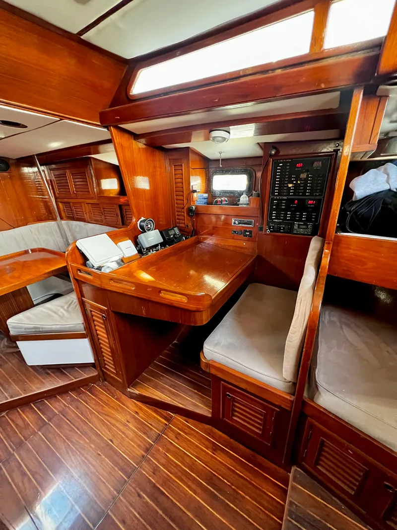 Slide: The Image of 1981 Cheoy Lee Golden Wave yacht interior with wooden finish and navigation station. - 33