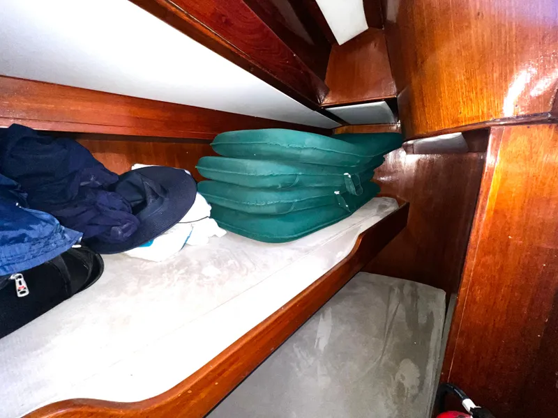 Slide: The Image of Interior cabin of 1981 Cheoy Lee Golden Wave yacht with cushions and storage. - 37