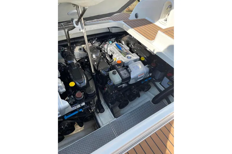 Slide: The Image of Engine compartment of a 2015 Formula 350 Sun Sport boat, showcasing dual engines. - 10