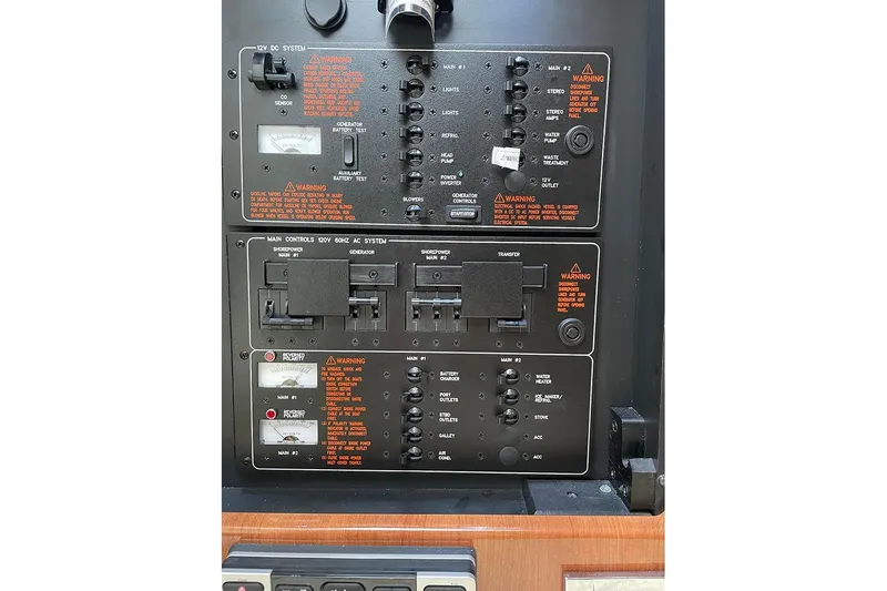 Slide: The Image of Control panel of a 2015 Formula 350 Sun Sport boat, featuring electrical systems. - 15