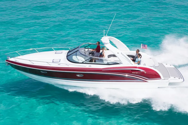 Slide: The Image of Manufacturer Provided Image: 2015 Formula 350 Sun Sport boat cruising on clear turquoise water. - 17