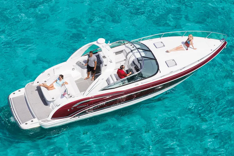 Slide: The Image of Manufacturer Provided Image: 2015 Formula 350 Sun Sport boat cruising on clear turquoise water. - 20