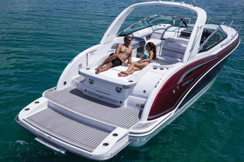 Slide: The Image of Manufacturer Provided Image: 2015 Formula 350 Sun Sport boat with people relaxing on deck in clear blue water. - 22