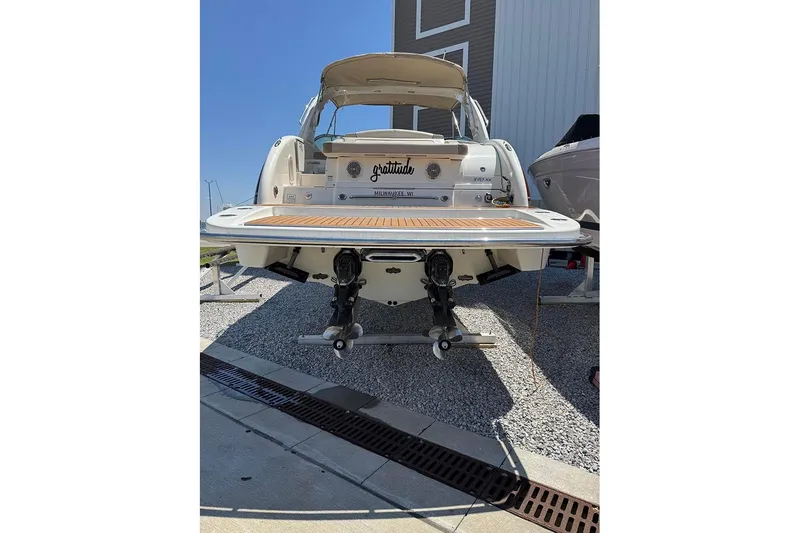 Slide: The Image of 2015 Formula 350 Sun Sport boat on display, rear view with swim platform. - 7