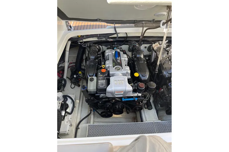 Slide: The Image of Engine compartment of a 2015 Formula 350 Sun Sport boat, showcasing detailed mechanics. - 9