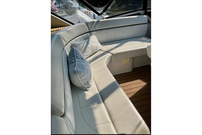 Slide: The Image of Luxurious seating area on 2001 Carver 396 Aft Cabin Motor Yacht with plush cushions. - 7