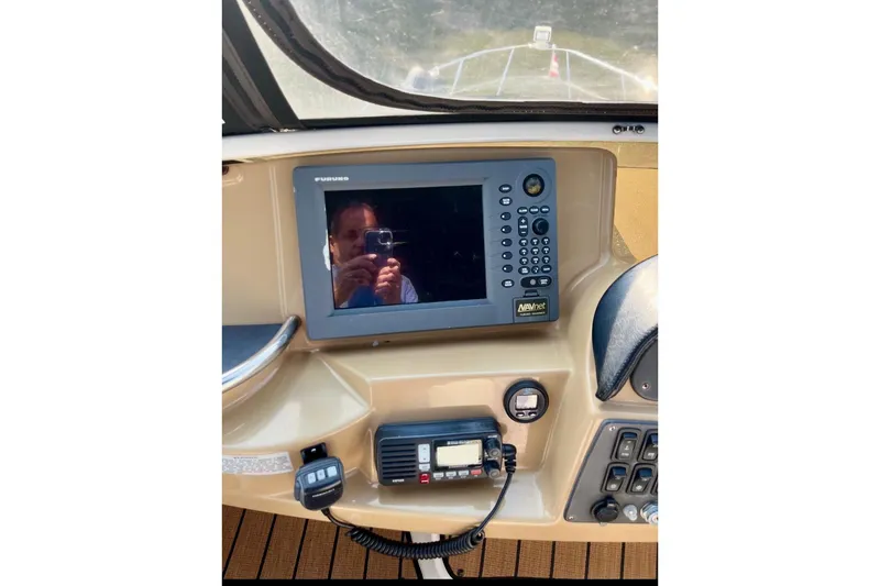 Slide: The Image of Control panel of 2001 Carver 396 Aft Cabin Motor Yacht with navigation equipment. - 11