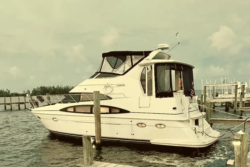 Slide: The Image of 2001 Carver 396 Aft Cabin Motor Yacht docked at marina. - 16