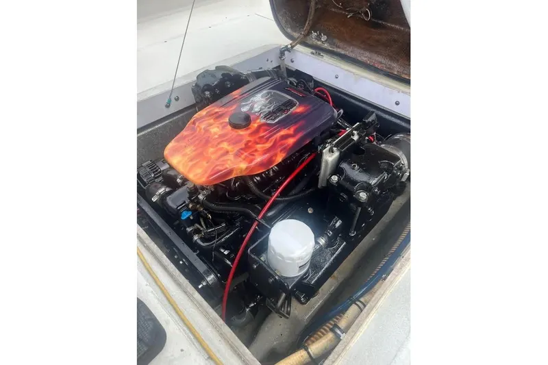 Slide: The Image of 1997 Stamas 290 Tarpon boat engine with custom flame-painted cover. - 15