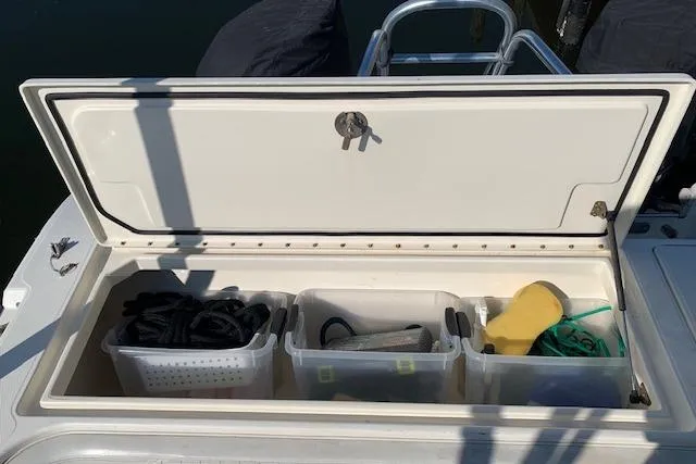 Slide: The Image of Storage compartment on a 2007 World Cat 250 DC boat with organized gear. - 4