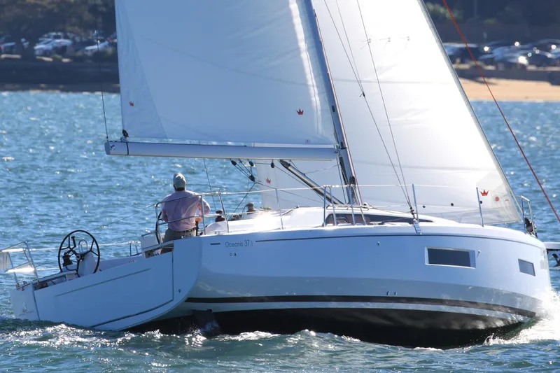 Slide: The Image of 2026 Beneteau Oceanis 37.1 sailing on open water, showcasing sleek design and performance. - 13