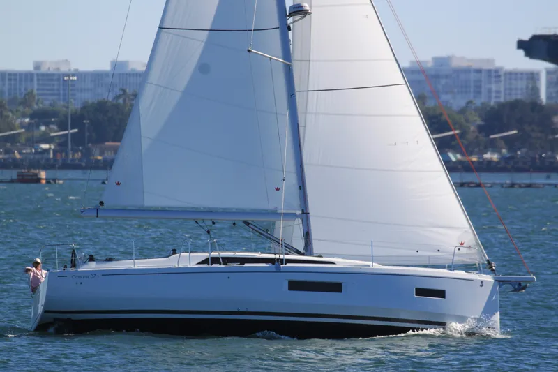 Slide: The Image of 2026 Beneteau Oceanis 37.1 sailing on a sunny day with cityscape background. - 16
