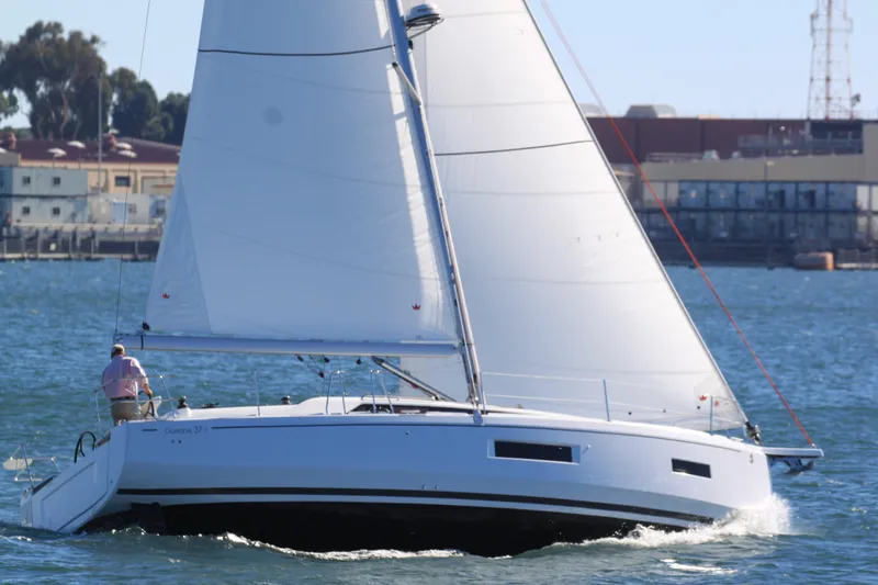 Slide: The Image of 2026 Beneteau Oceanis 37.1 sailing on a sunny day near the coast. - 19