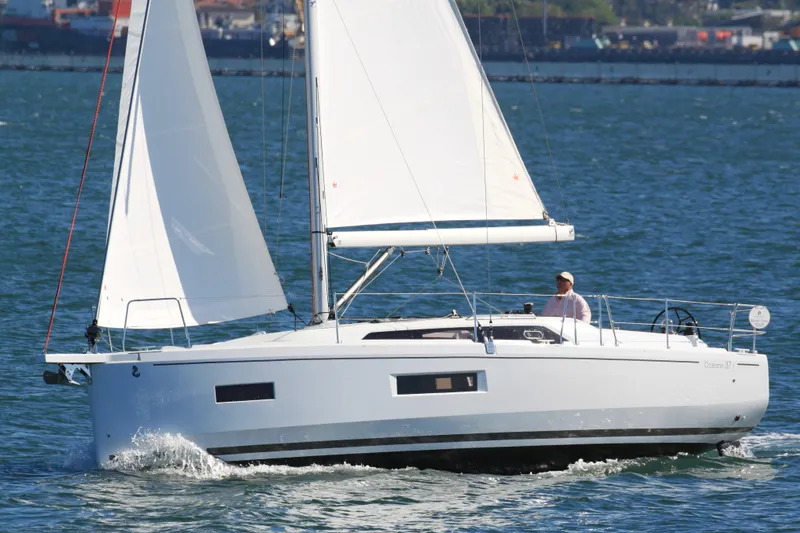 Slide: The Image of 2026 Beneteau Oceanis 37.1 sailing on open water, showcasing sleek design and performance. - 4