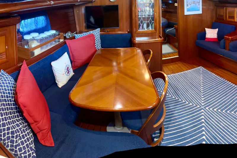 Slide: The Image of Luxurious interior of 2004 Beneteau 50 yacht with elegant wood finish and cozy seating. - 11