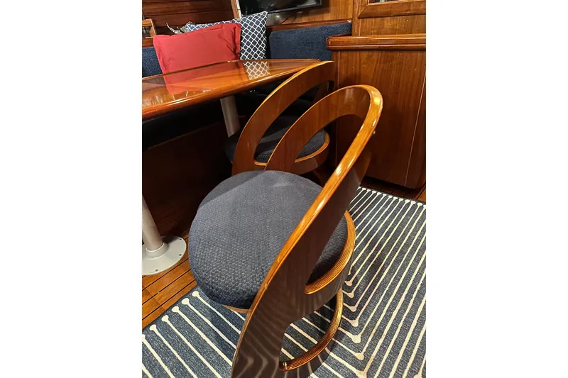 Slide: The Image of Elegant interior of 2004 Beneteau 50 yacht with stylish wooden chair and table. - 14