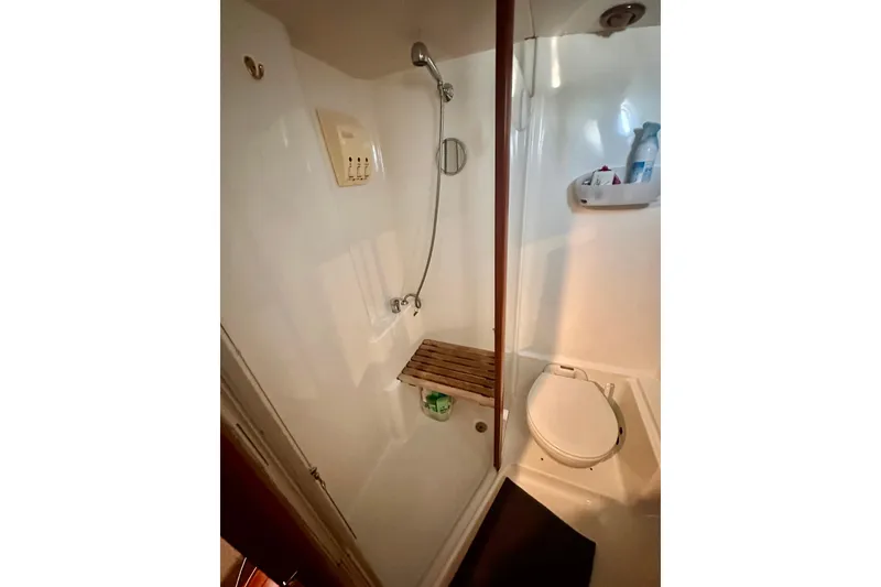 Slide: The Image of Bathroom interior of 2004 Beneteau 50 yacht with shower and toilet. - 18