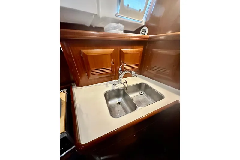 Slide: The Image of Beneteau 50 yacht kitchen sink with wooden cabinets, 2004 model. - 27