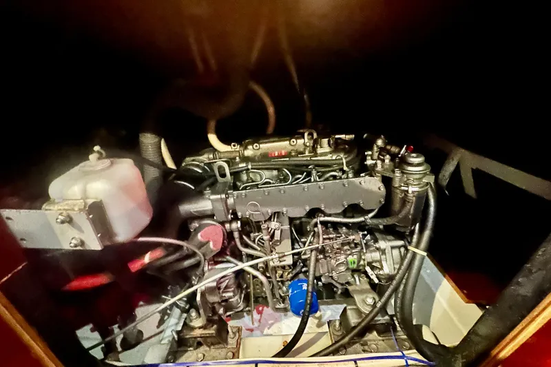 Slide: The Image of Engine compartment of a 2004 Beneteau 50 sailboat, showcasing mechanical components. - 29