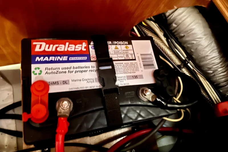 Slide: The Image of Duralast marine battery in a 2004 Beneteau 50 yacht, connected with cables. - 35