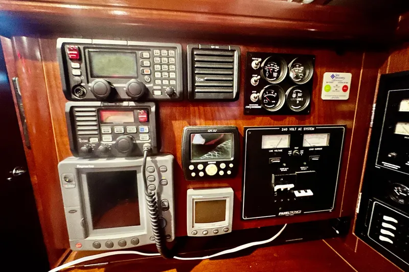 Slide: The Image of Control panel of a 2004 Beneteau 50 yacht with navigation and communication equipment. - 36