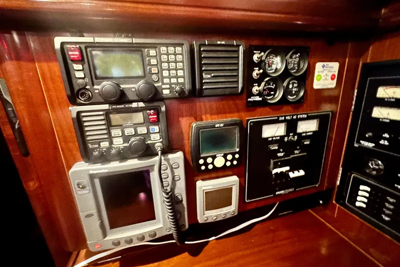 Slide: The Image of Control panel of a 2004 Beneteau 50 yacht with navigation and communication equipment. - 38