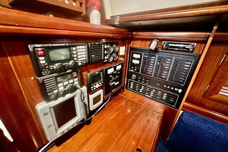 Slide: The Image of Control panel of a 2004 Beneteau 50 yacht with navigation and communication equipment. - 39
