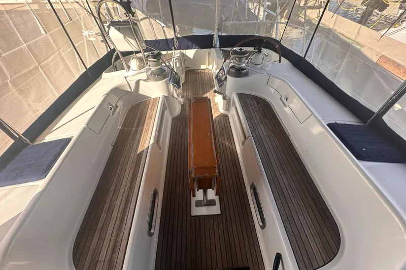 Slide: The Image of 2004 Beneteau 50 yacht cockpit with wooden flooring and seating. - 40