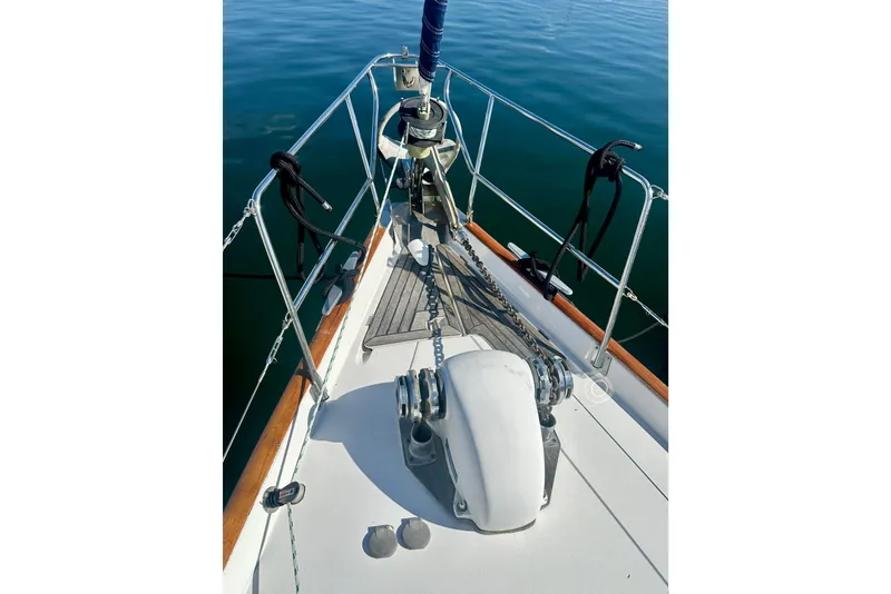 Slide: The Image of Bow of a 2004 Beneteau 50 sailboat with anchor and railing. - 47