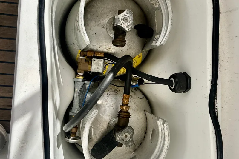 Slide: The Image of Propane tanks in a 2004 Beneteau 50 yacht storage compartment. - 49